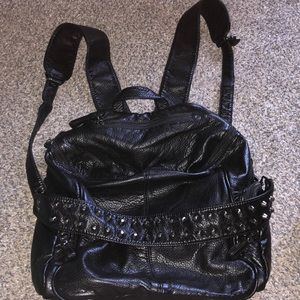 Small black backpack with removable shoulder strap